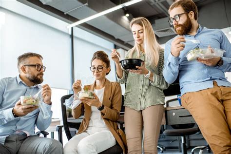 colleagues eating salad in the office stock image image of corporate