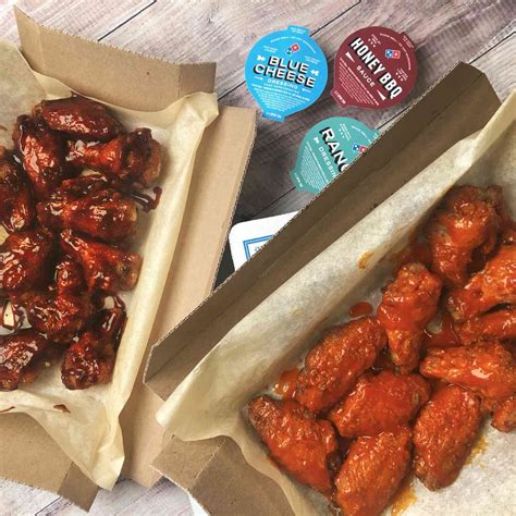 dominos unveils   improved chicken wings  sauces peoplecom