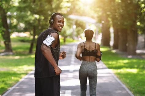 Sport Training Black Athlete Guy Running With Female Fitness Partner