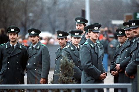 east german ddr officers at the opening of brandenburg gate 1989