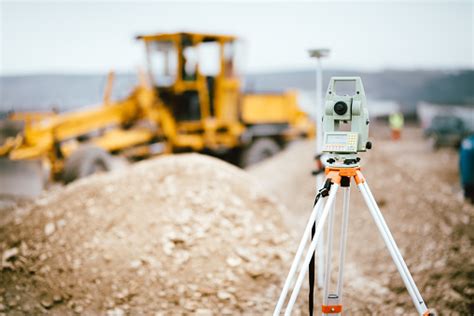 surveyor equipment gps system  theodolite outdoors  highway construction site surveyor