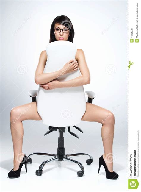 Beautiful Naked Dark Haired Woman Sitting On White Chair