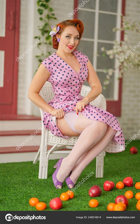 beautiful redheaded pin girl sexy pink polka dot dress