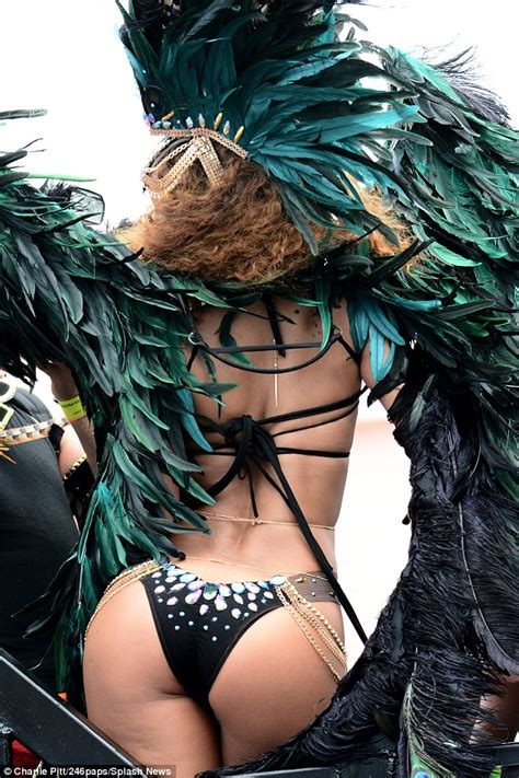 rihanna shows off her curvy figure as she parties at barbados carnival daily mail online