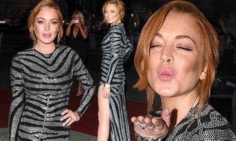 lindsay lohan legs it to the gq men of the year awards in revealing