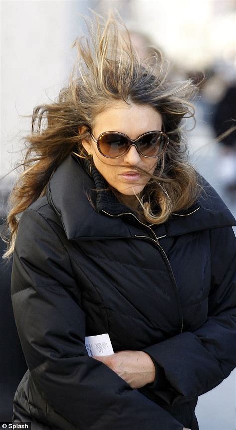 elizabeth hurley has a hair raising moment as she battles a gust of