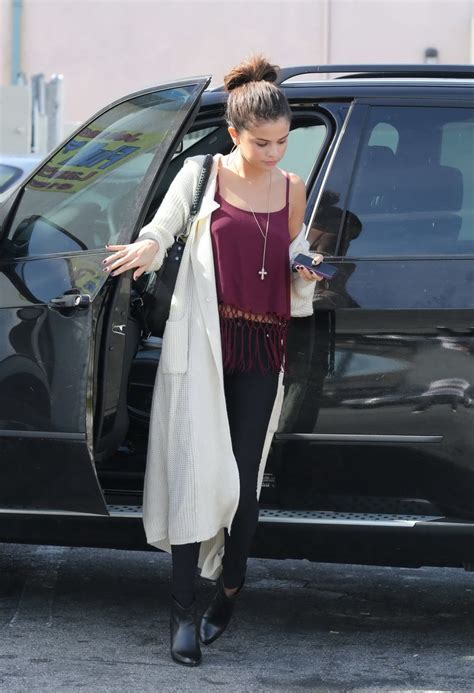 selena gomez braless wearing skimpy purple top and tights out in los