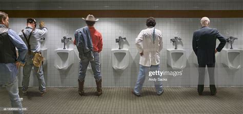 Four Men Standing At Urinal Rear View Stock Foto Getty Images