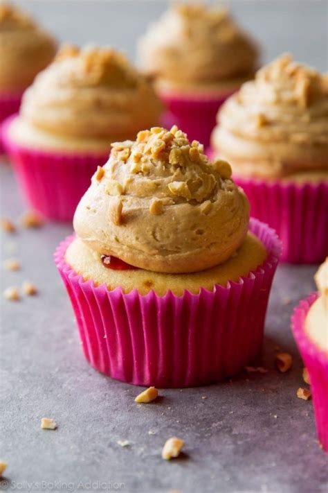 Soft And Fluffy Vanilla Cupcakes Topped With Peanut Butter Frosting And