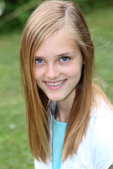 Smiling Teenage Girl With Braces On Her Teeth Stock Image