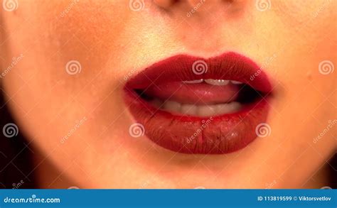 Young Female Licking Her Lips Close Up Shot Of Beautiful Woman Tongue