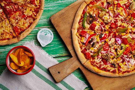 dominos officially launches vegan cheese pizza  vegan garlic dip herie