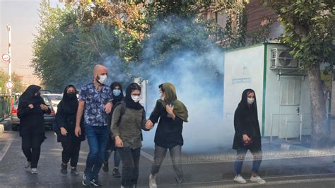 irans students clash  riot police  university protests itv news