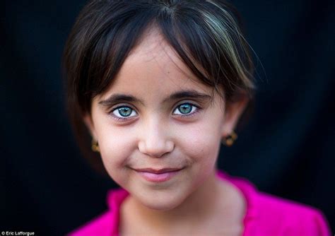 pale eyed portraits of kurdistan offer insight into lives of refugees