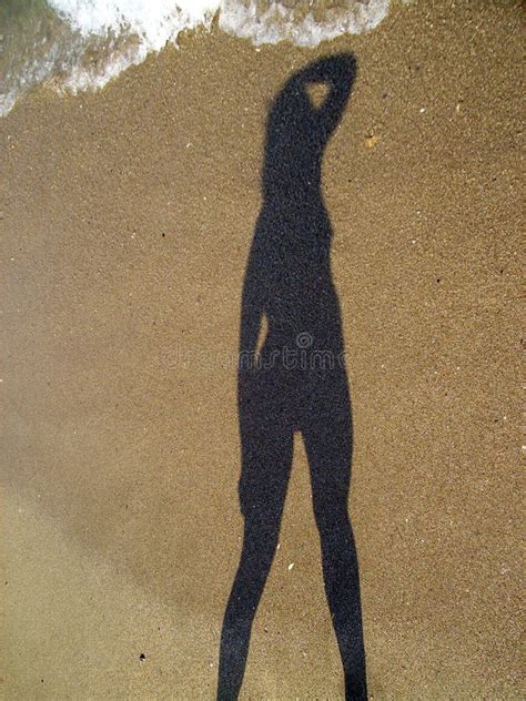 girl shadow stock photo image  sand seaside sunlight