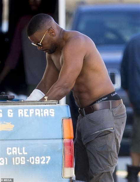 jamie foxx shows off his muscular physique after push ups on the set of