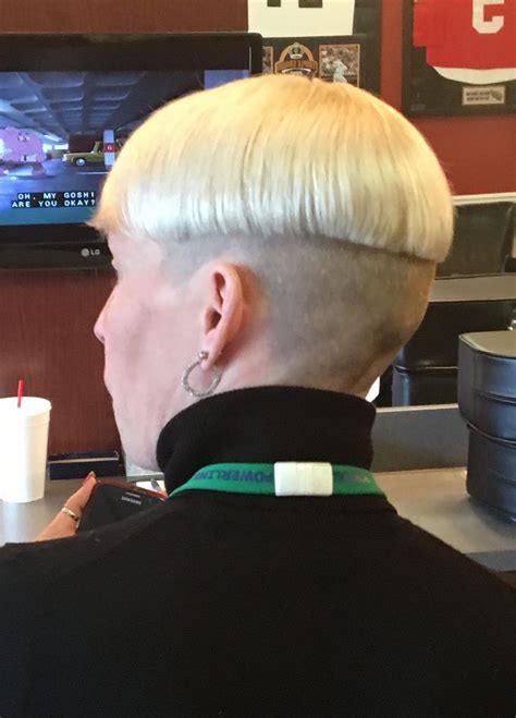 blonde two tone shaved nape bowlcut with turtleneck and