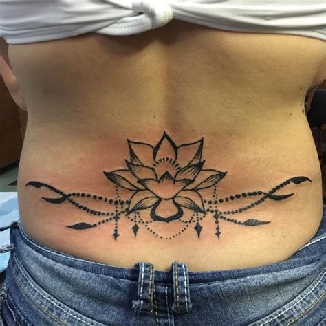 lower back tattoo lotus