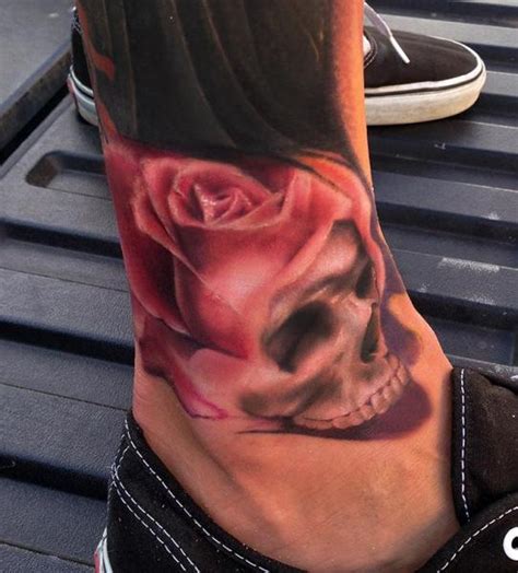foot flower skull tattoo by art junkies tattoos