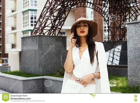 Raven Haired Indian Lady Posing In Backyard Of High Rise