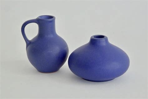 pair of diminutive matte cobalt blue west german pottery vessels for