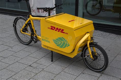 dhl electrical delivery bicycle  amsterdam  netherlands  editorial stock photo image