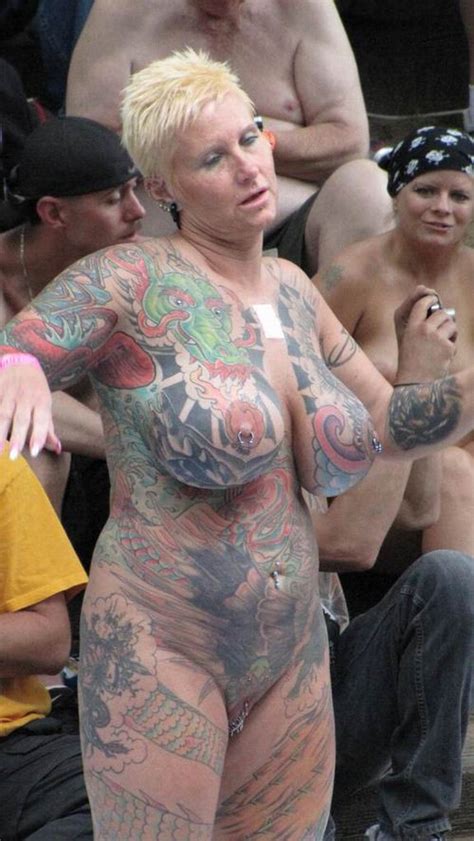 busty tattoed and pierced mature showing off in the public pichunter