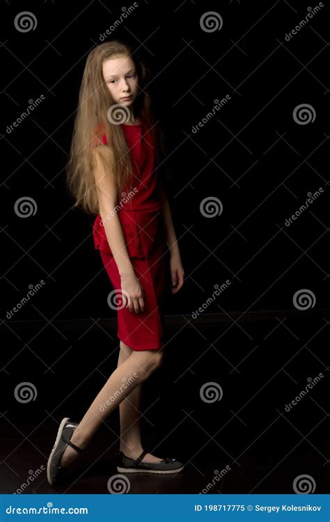 Beautiful Girl Standing Sideways To Camera With One Leg Up Stock Image