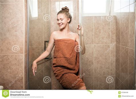 A Sexy Young Girl Takes A Shower In The Bathroom On A Brown Tile
