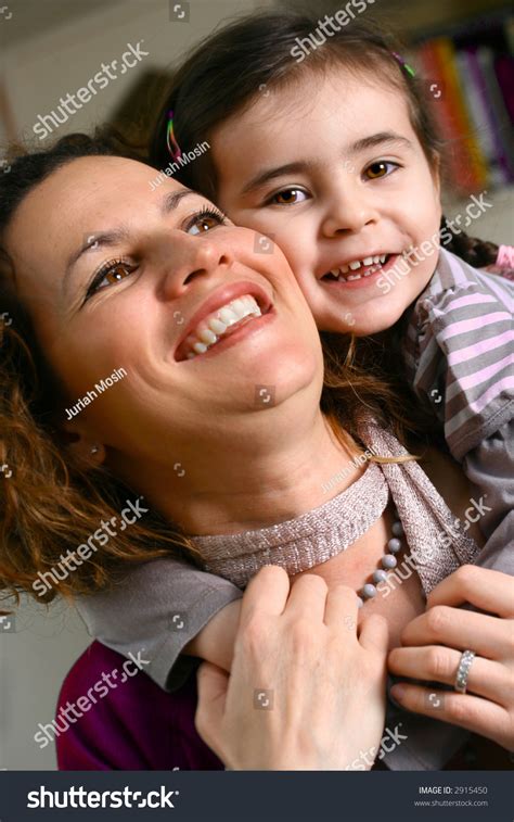 Beautiful Mother And Daughter Of Ethnic Background Enjoying Some
