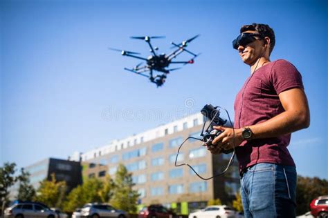 handsome young man flying  drone outdoors stock photo image  pilot flight