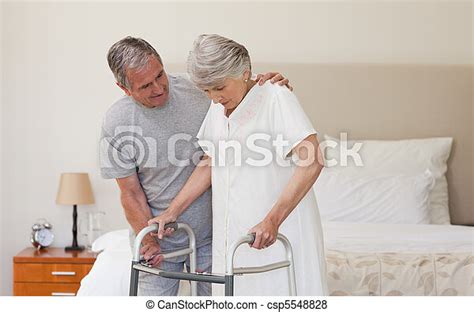 Man Helping His Wife To Walk Stock Image Everypixel