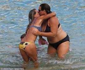 pierce brosnan watches on as bikini clad wife keely shaye smith takes a dip with gal pal in
