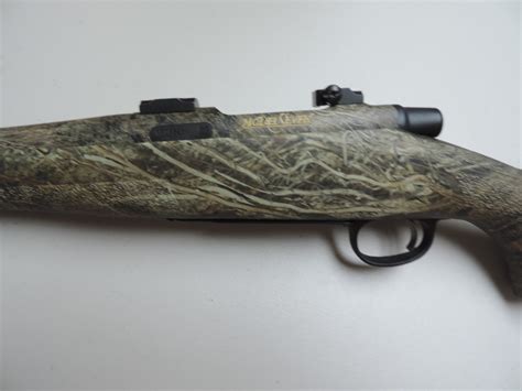 remington model     flutted barrel camo gun  reserve  win  sale