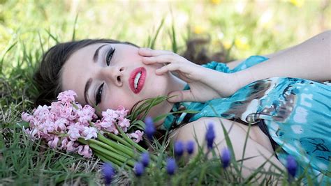 Royalty Free Photo Woman Laying On Grass Field With Flowers Pickpik