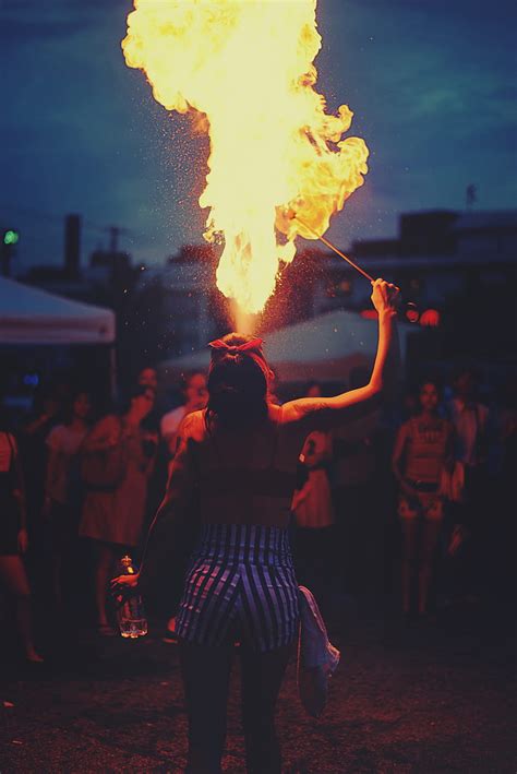 woman performing fire spitting hd phone wallpaper peakpx