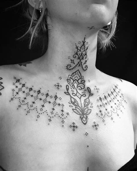 symmetrical lotus flower  dots tattoo chest tattoos  women