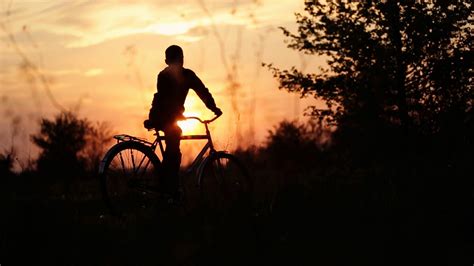 boy riding bicycle  village sun   stock footage sbv