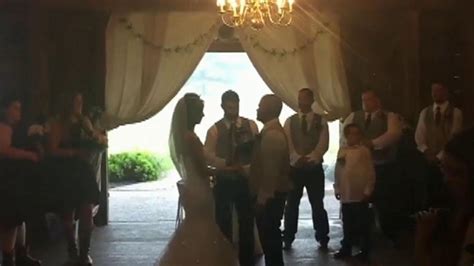 wedding photographer praised after video of her pushing stepmother out