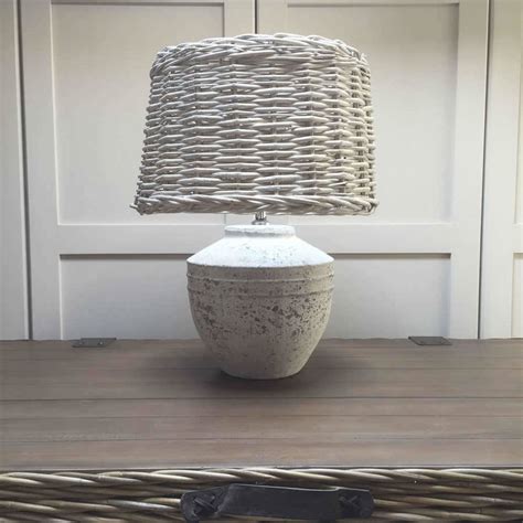 grey ceramic lamp base  wicker shade  cowshed interiors