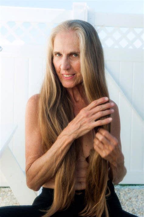 Partially Nude 57 Year Old Woman With Long Hair Smiling At The Camera