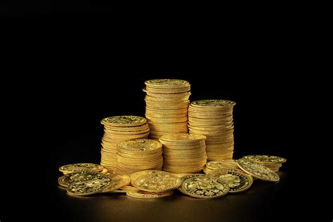 stacks   pile   gold coins photograph  stefan rotter