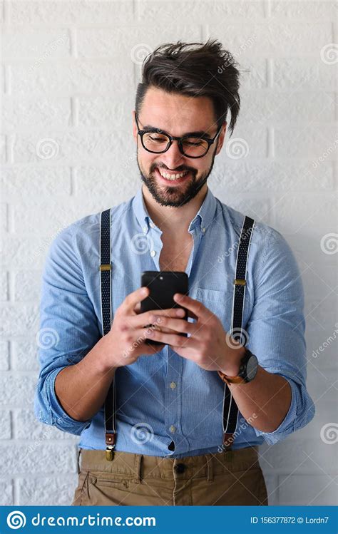 Portrait Of Handsome Bearded Hipster Guy With Glasses On