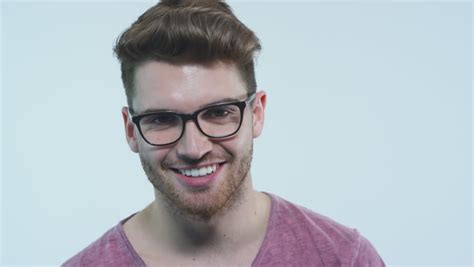 White Male Hipster With A Mustache And Glasses Looks Into