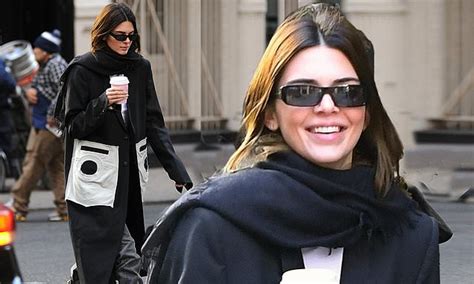 kendall jenner flashes a smile as she strolls in nyc with a cup of