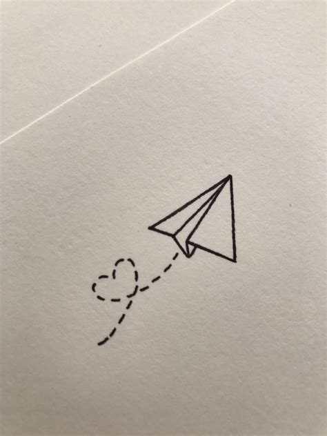paper airplane flying   air   heart drawn   side