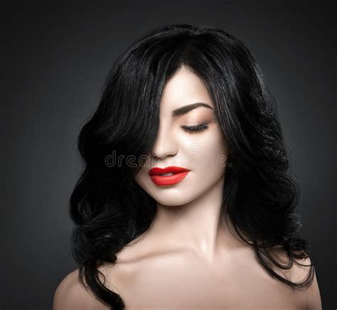 beautiful brunette woman with shot hairstyle and red lips stock image