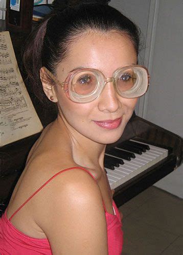 cute black haired girl at piano wearing big strong glasses… flickr