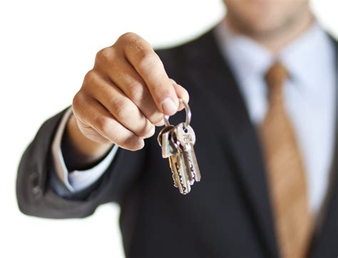 businessman handing  keys auto  financial services