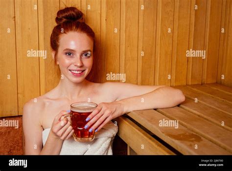 Redhaired Ginger Woman Steaming In The Bathhouse With Russian Bunch